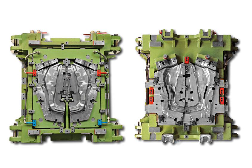 Eine Vogelperspektive auf das Oberteil und Unterteil eines grünen Warmumformwerkzeugs, das speziell für die Produktion von A-Säulen von Fahrzeugen konzipiert ist. 