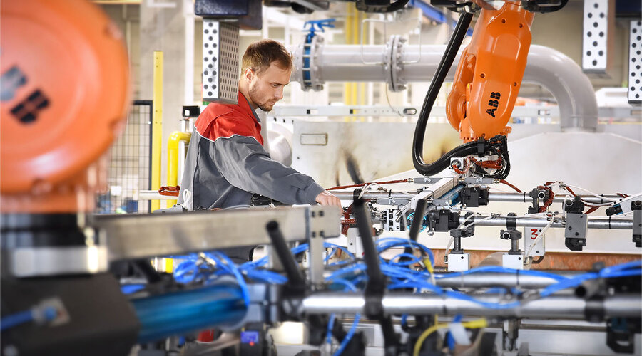 A press operator sets up the press hardening line before series production in press hardening.